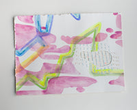 An abstract watercolor painting of flowers on paper.