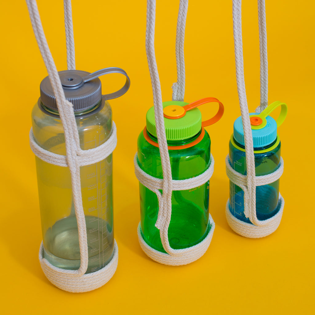 Shop What Goes Around Upcycled Water Bottle Sling Inspired by